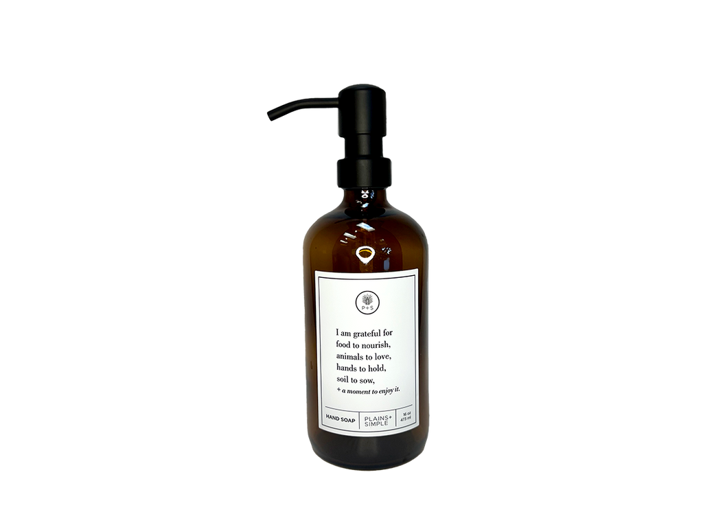 Amber glass I Am Grateful hand soap Gratitude Bottle with black pump.