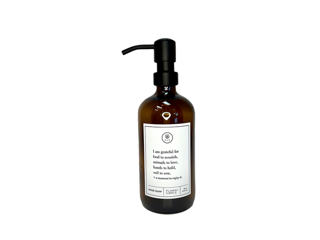 Amber glass I Am Grateful hand soap Gratitude Bottle with black pump.