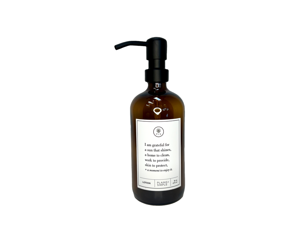Amber glass I Am Grateful Gratitude Lotion Bottle with black pump.