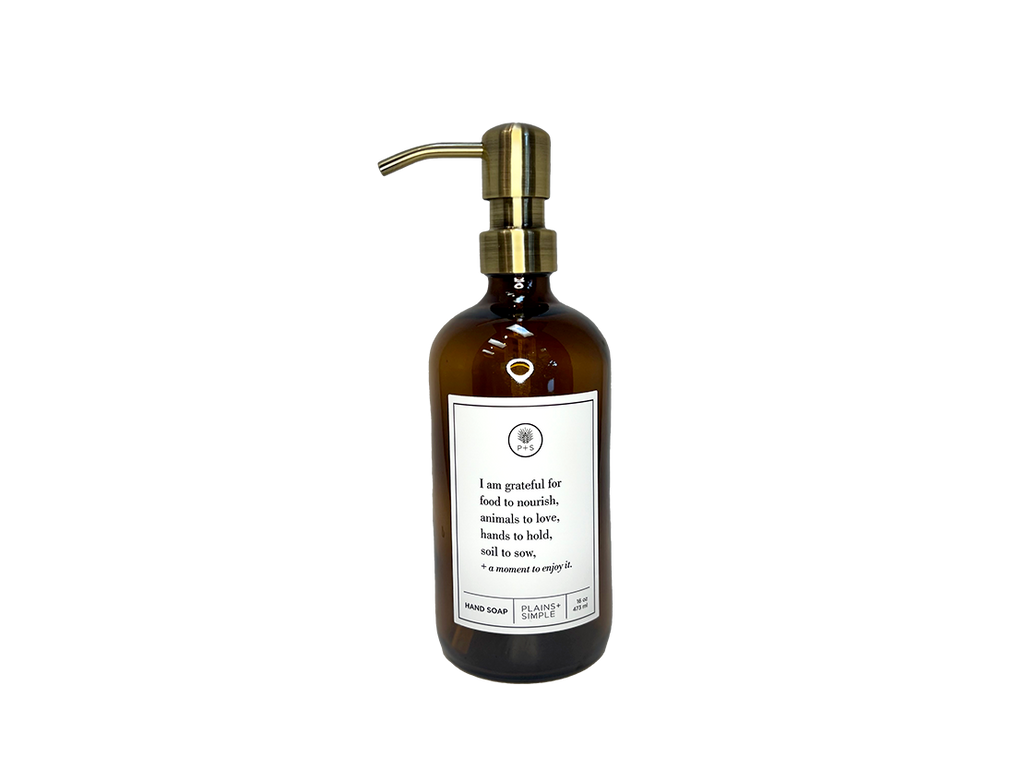 Amber glass I Am Grateful hand soap Gratitude Bottle with gold pump.