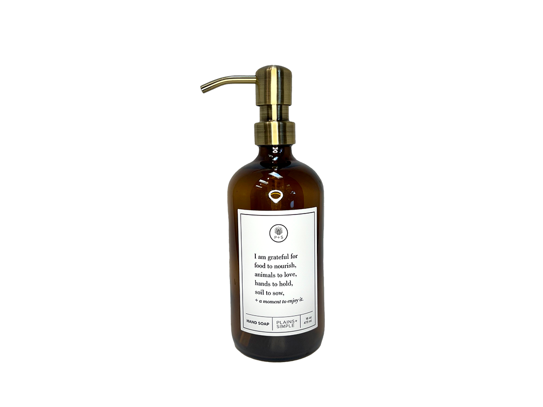 Amber glass I Am Grateful hand soap Gratitude Bottle with gold pump.