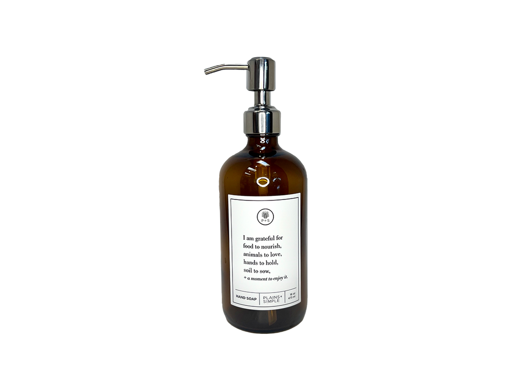 Amber glass I Am Grateful hand soap Gratitude Bottle with silver pump.