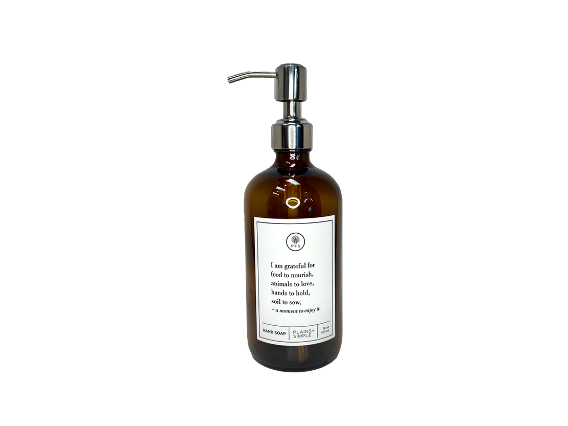 Amber glass I Am Grateful hand soap Gratitude Bottle with silver pump.