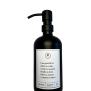 Black glass I Am Grateful dish soap Gratitude Bottle with black pump.