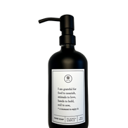Black glass I Am Grateful hand soap Gratitude Bottle with black pump.