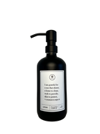 Black glass I Am Grateful Gratitude Lotion Bottle with black pump.