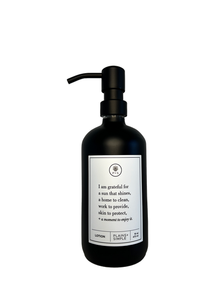 Black glass I Am Grateful Gratitude Lotion Bottle with black pump.