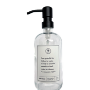 Clear glass I Am Grateful dish soap Gratitude Bottle with black pump.