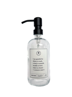 Clear glass I Am Grateful dish soap Gratitude Bottle with black pump.
