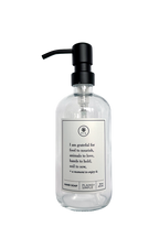 Clear glass I Am Grateful hand soap Gratitude Bottle with black pump.