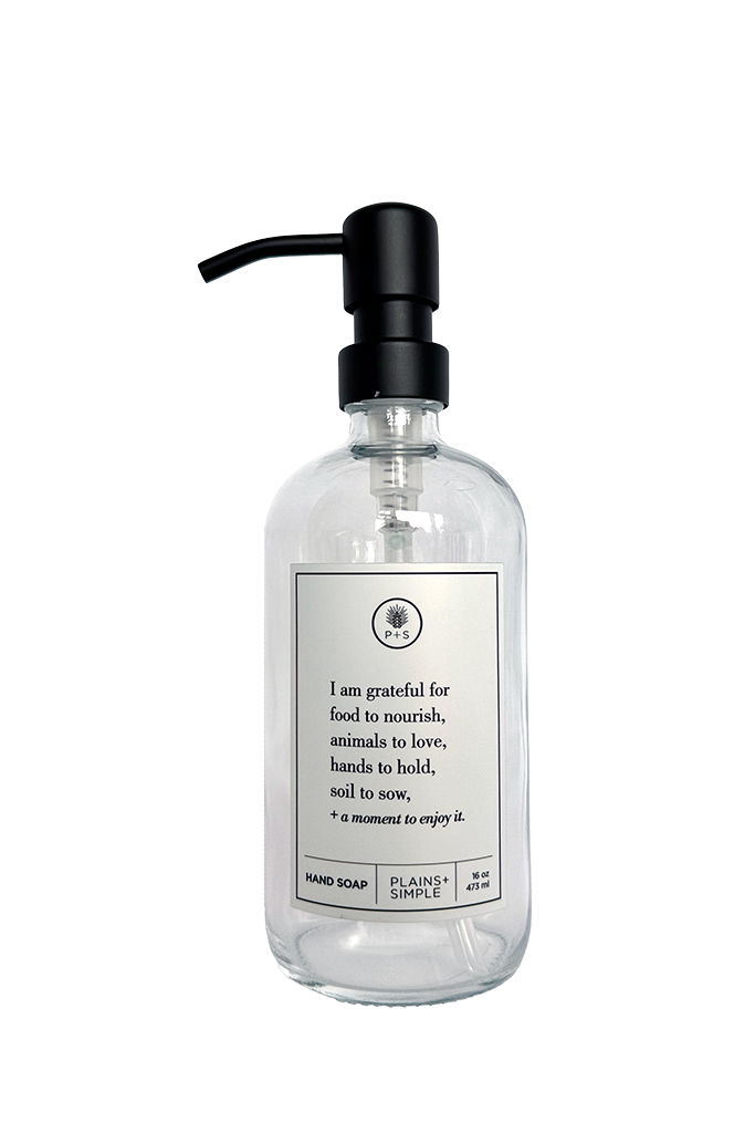 Clear glass I Am Grateful hand soap Gratitude Bottle with black pump.