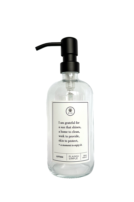 Clear glass I Am Grateful Lotion Gratitude Bottle with black pump.