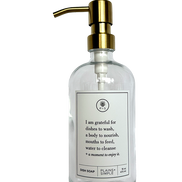 Clear glass I Am Grateful dish soap Gratitude Bottle with gold pump.