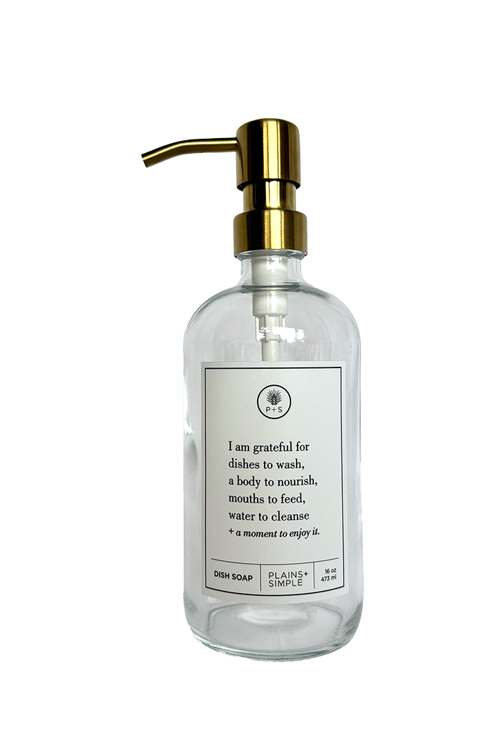Clear glass I Am Grateful dish soap Gratitude Bottle with gold pump.