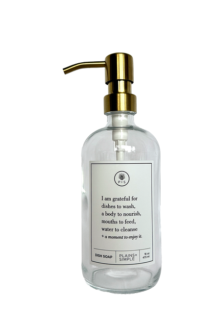 Clear glass I Am Grateful dish soap Gratitude Bottle with gold pump.
