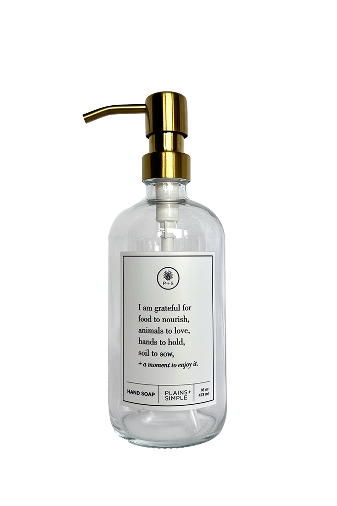 Clear glass I Am Grateful hand soap Gratitude Bottle with gold pump.