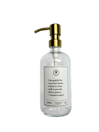 Clear glass I Am Grateful Lotion Gratitude Bottle with gold pump.