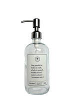 Clear glass I Am Grateful dish soap Gratitude Bottle with silver pump.