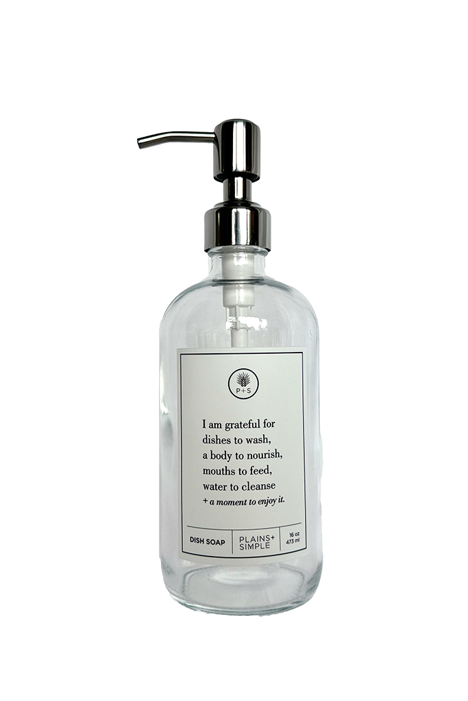 Clear glass I Am Grateful dish soap Gratitude Bottle with silver pump.