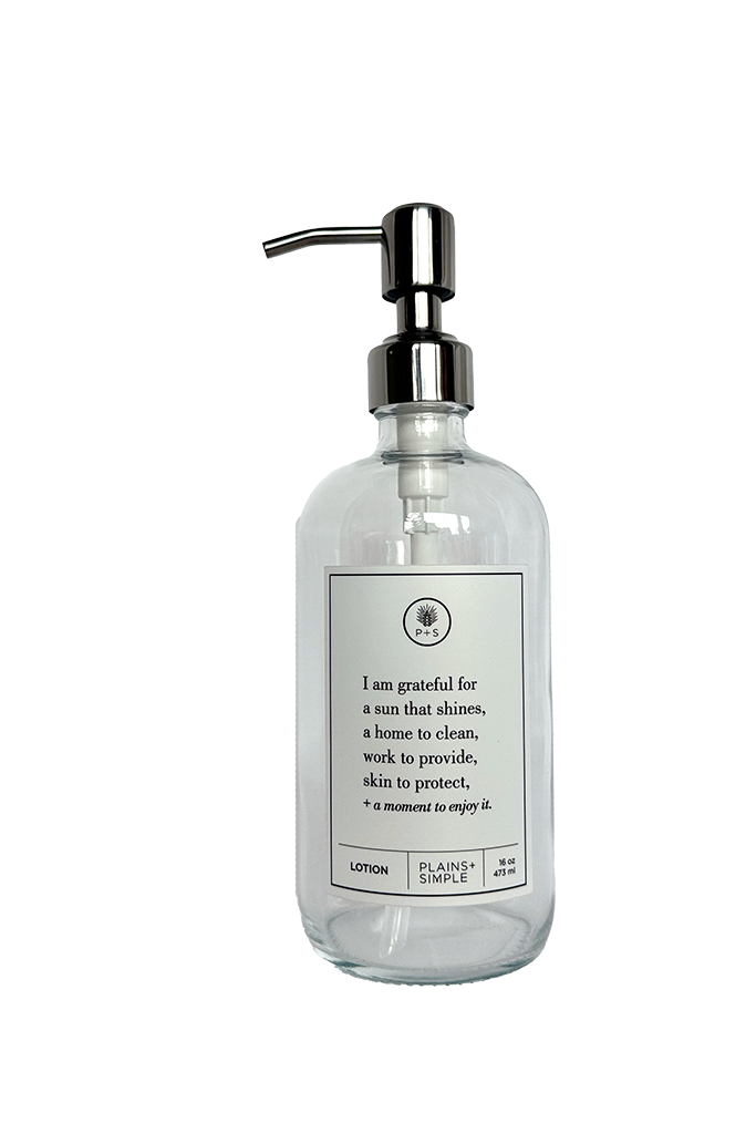 Clear glass I Am Grateful Lotion Gratitude Bottle with silver pump.