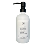 White glass I Am Grateful hand soap Gratitude Bottle with black pump.
