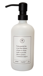 White glass I Am Grateful Lotion Gratitude Bottle with black pump.