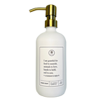 White glass I Am Grateful hand soap Gratitude Bottle with gold pump.