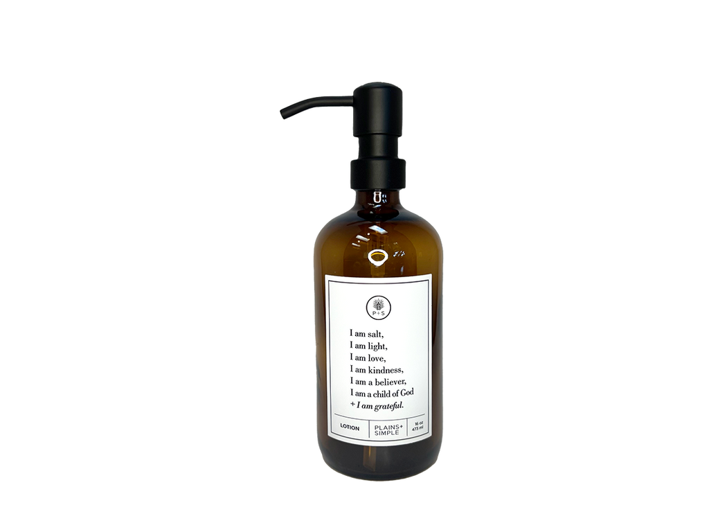 Amber glass I am Salt & Light lotion Gratitude Bottle with black pump.