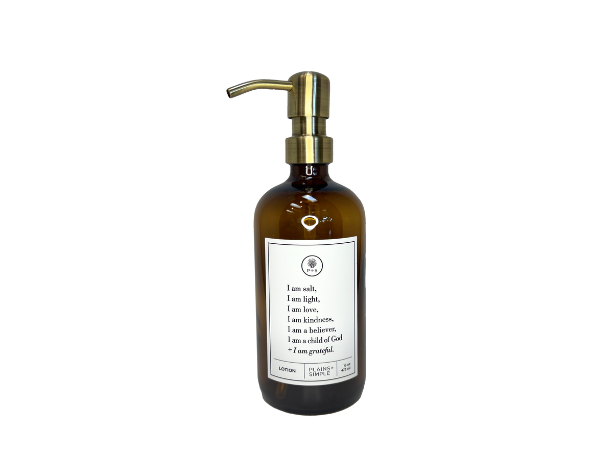 Amber glass I am Salt & Light lotion Gratitude Bottle with gold pump.