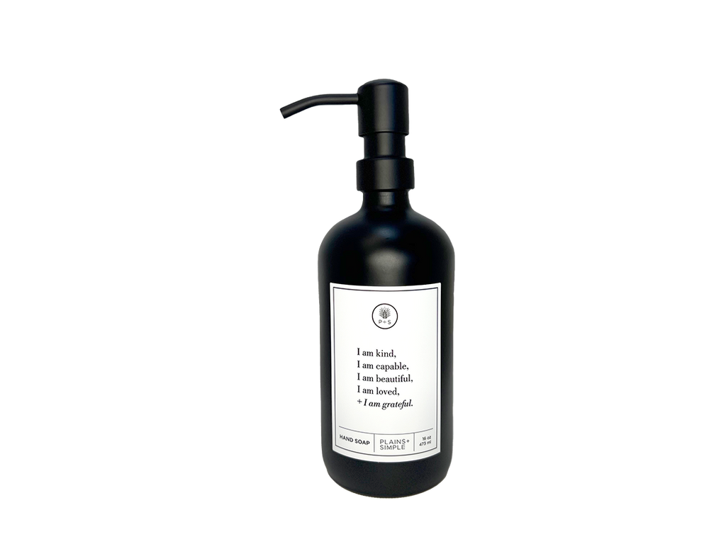 Black glass I am Kind hand soap Gratitude Bottle with black pump.