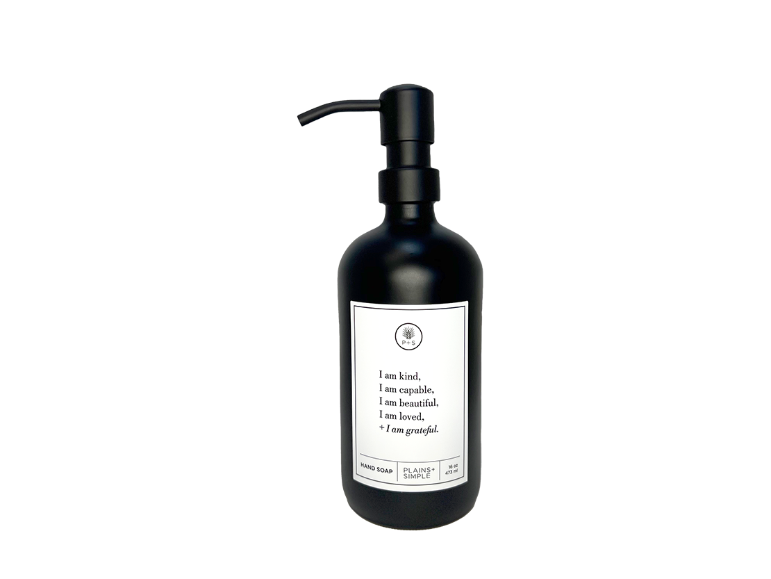 Black glass I am Kind hand soap Gratitude Bottle with black pump.