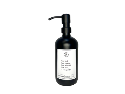 Black glass I am Kind hand soap Gratitude Bottle with black pump.