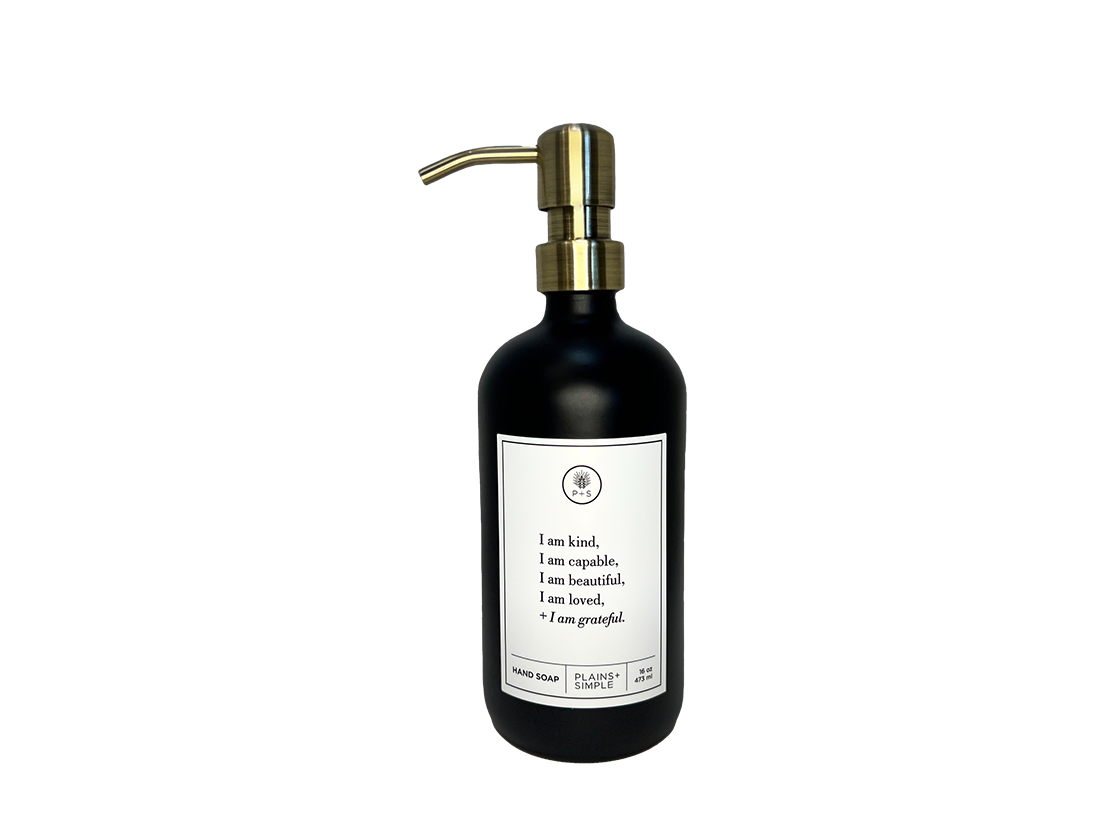Black glass I am Kind hand soap Gratitude Bottle with gold pump.
