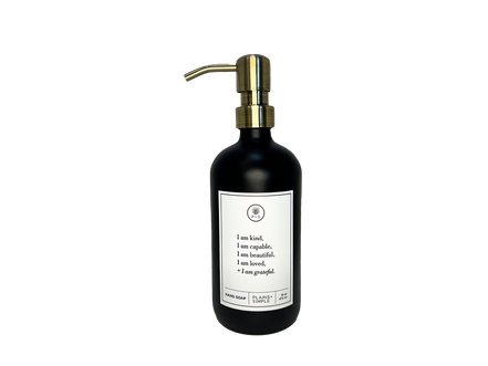 Black glass I am Kind hand soap Gratitude Bottle with gold pump.