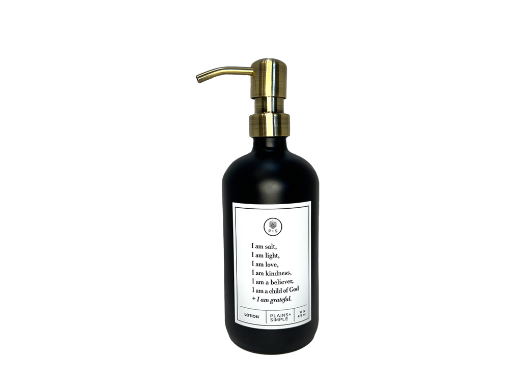 Black glass I am Salt & Light lotion Gratitude Bottle with gold pump.