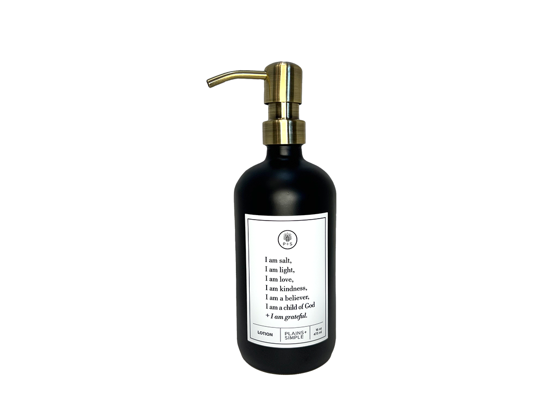 Black glass I am Salt & Light lotion Gratitude Bottle with gold pump.