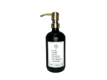 Black glass I am Salt & Light lotion Gratitude Bottle with gold pump.