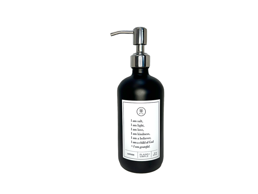 Black glass I am Salt & Light lotion Gratitude Bottle with silver pump.