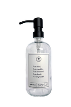 Clear glass I am Kind hand soap Gratitude Bottle with black pump.