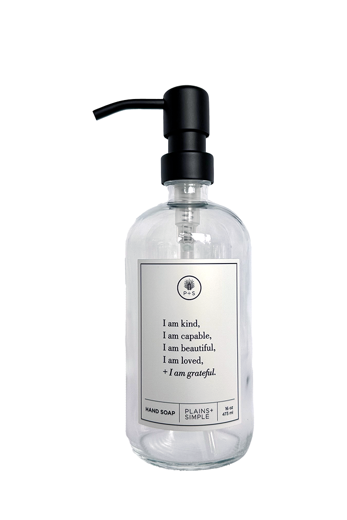 Clear glass I am Kind hand soap Gratitude Bottle with black pump.
