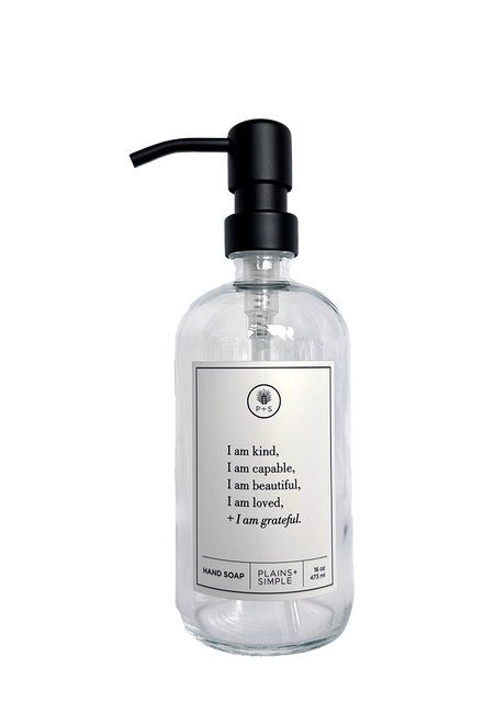 Clear glass I am Kind hand soap Gratitude Bottle with black pump.