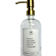 Clear glass I am Kind hand soap Gratitude Bottle with gold pump.