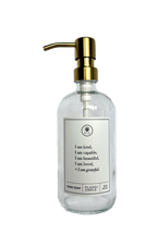 Clear glass I am Kind hand soap Gratitude Bottle with gold pump.