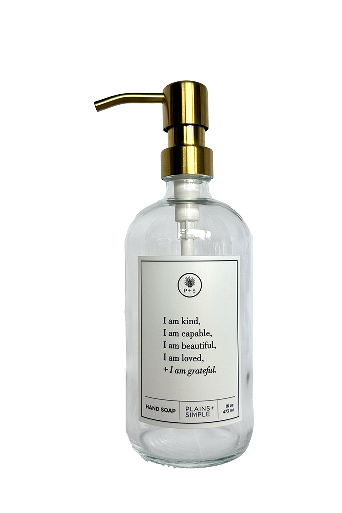 Clear glass I am Kind hand soap Gratitude Bottle with gold pump.