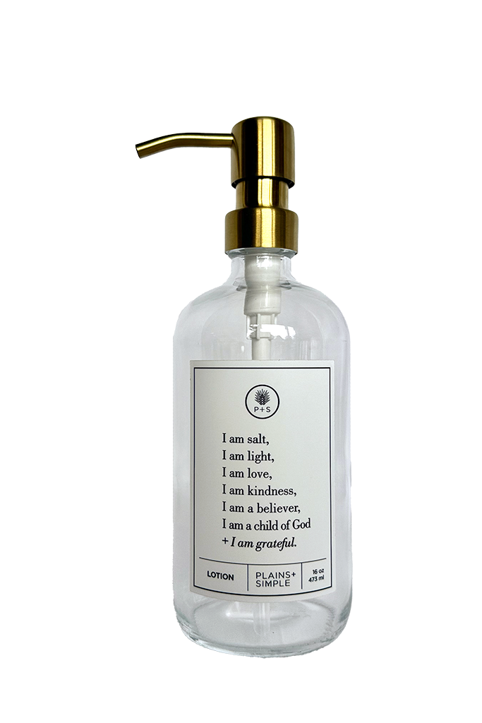 Clear glass I am Salt & Light lotion Gratitude Bottle with gold pump.