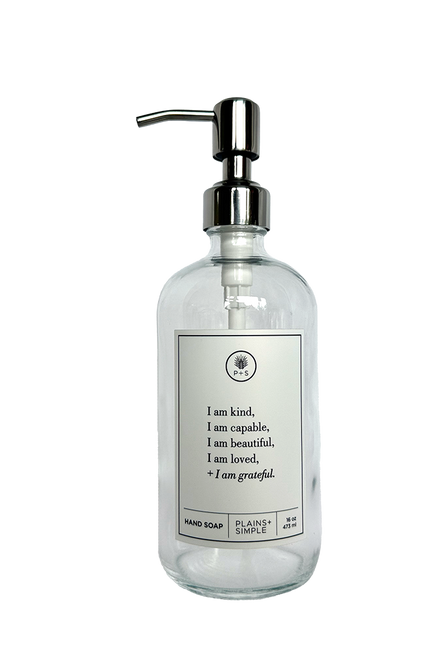 Clear glass I am Kind hand soap Gratitude Bottle with silver pump.