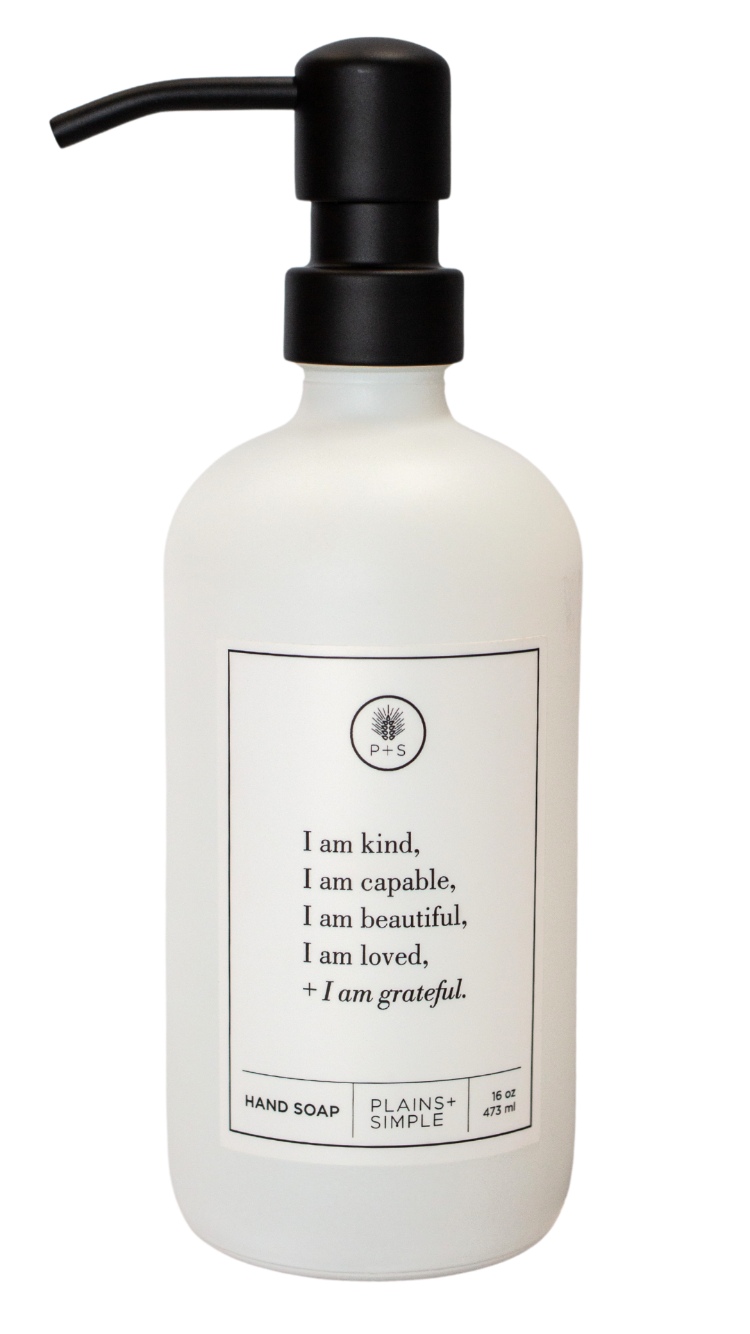 White glass I am Kind hand soap Gratitude Bottle with black pump.