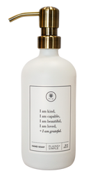 White glass I am Kind hand soap Gratitude Bottle with gold pump.