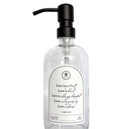 Clear glass Love Is... multipurpose Gratitude Bottle with black pump.