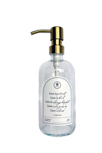 Clear glass Love Is... multipurpose Gratitude Bottle with gold pump.